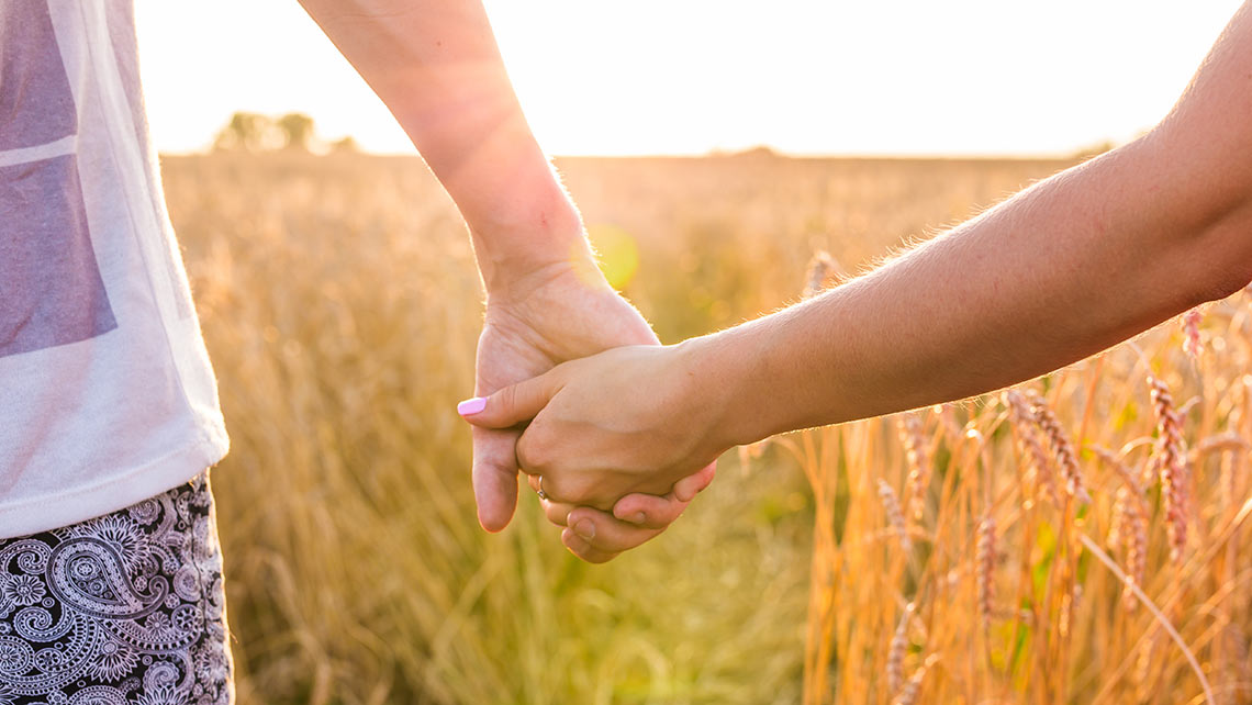 Couple holding hands